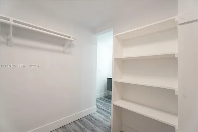 a view of an empty walk in closet