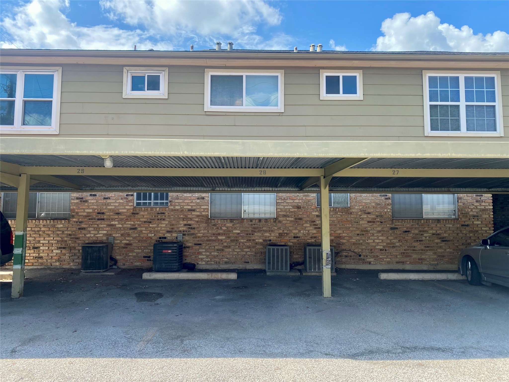 6401 Skyline Drive, Unit 28 Houston, TX 77057 - Photo 13 of 14 a view of building with barbeque grill and brick wall