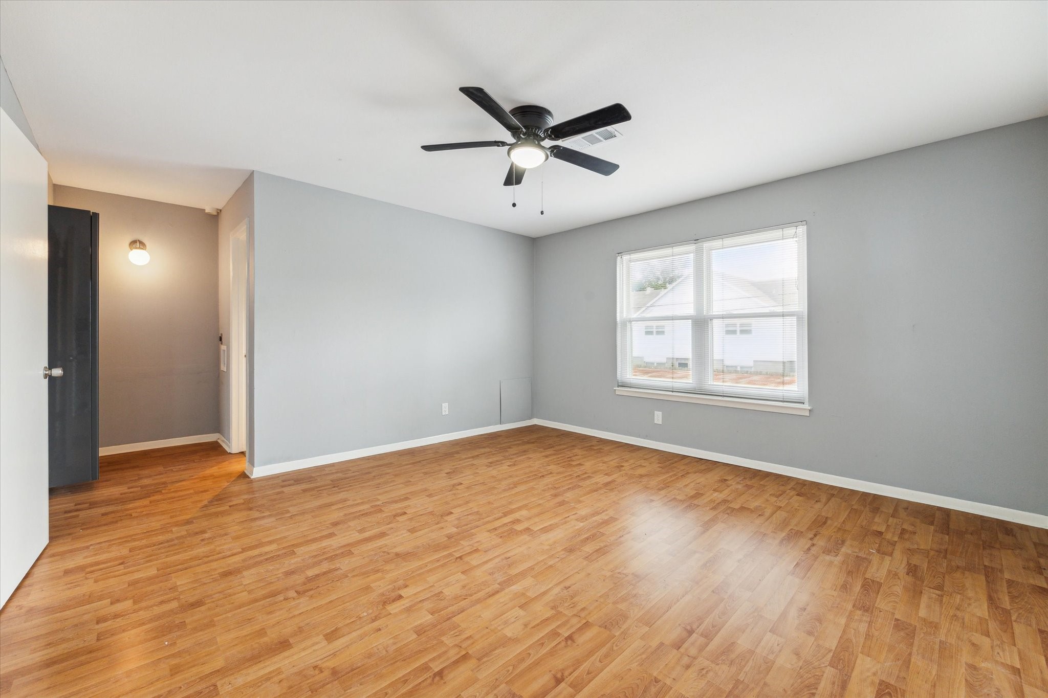 6401 Skyline Drive, Unit 28 Houston, TX 77057 - Photo 10 of 14 wooden floor in an empty room with a window