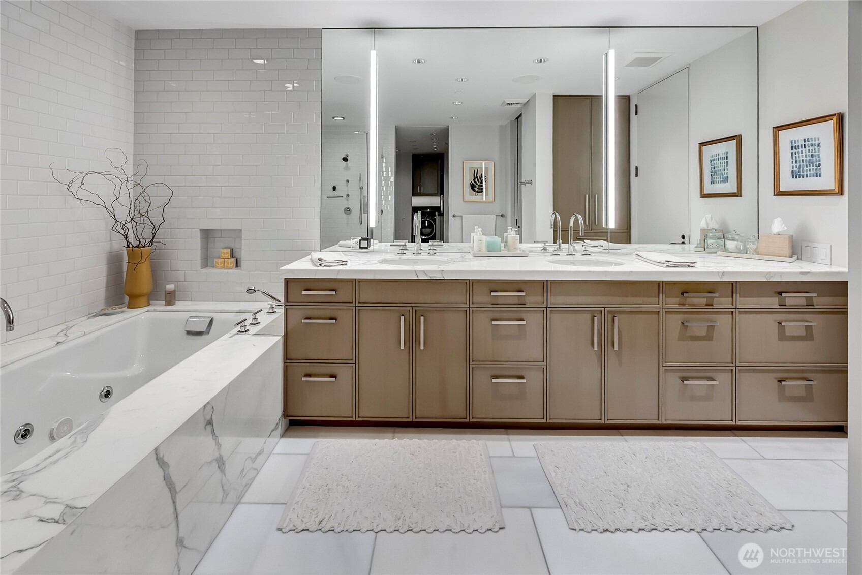 715 2nd Avenue, Unit 1702 Seattle, WA 98104 - Photo 26 of 38 a spacious bathroom with a granite countertop sink mirror and bathtub