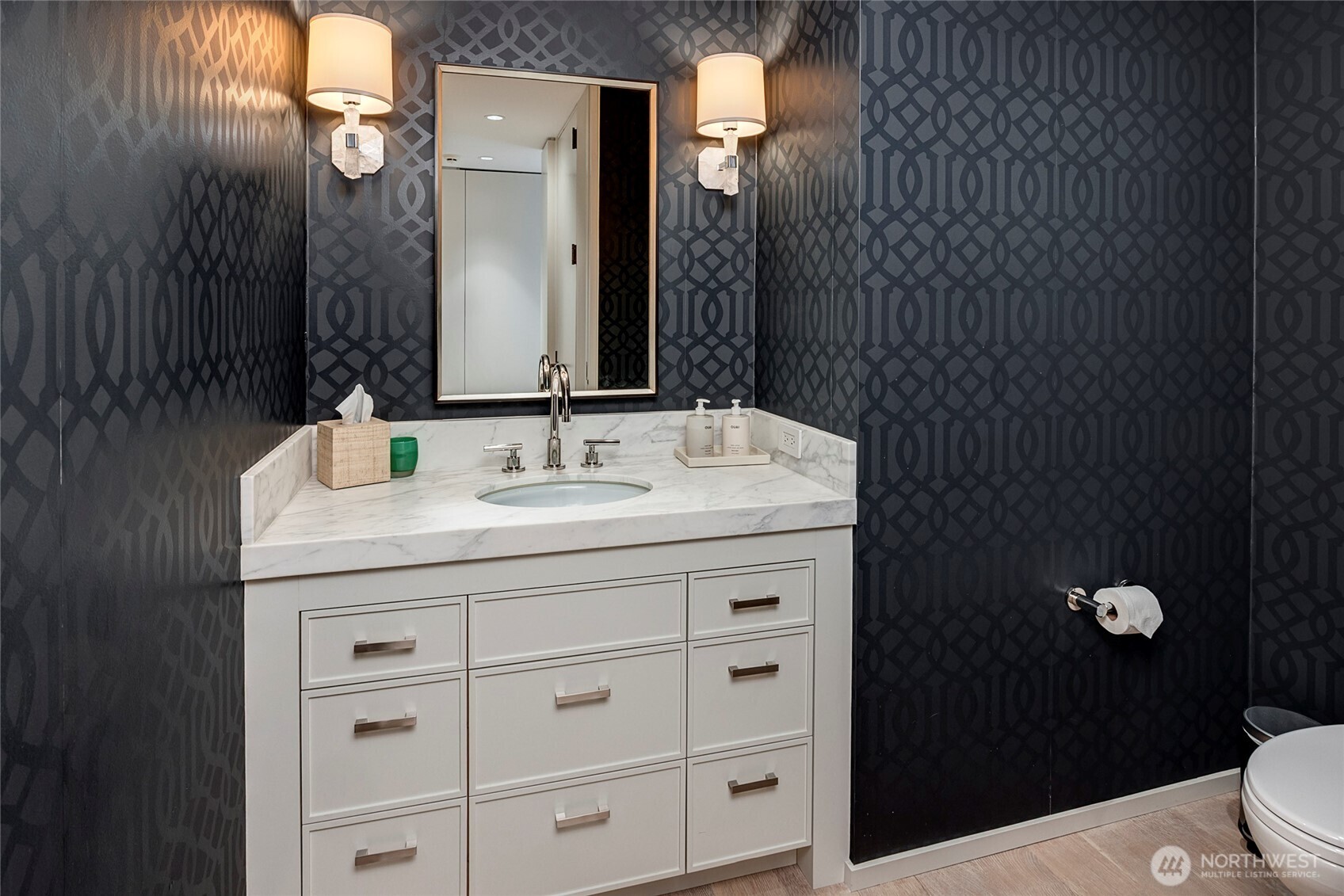 715 2nd Avenue, Unit 1702 Seattle, WA 98104 - Photo 28 of 38 a bathroom with a sink vanity and a mirror