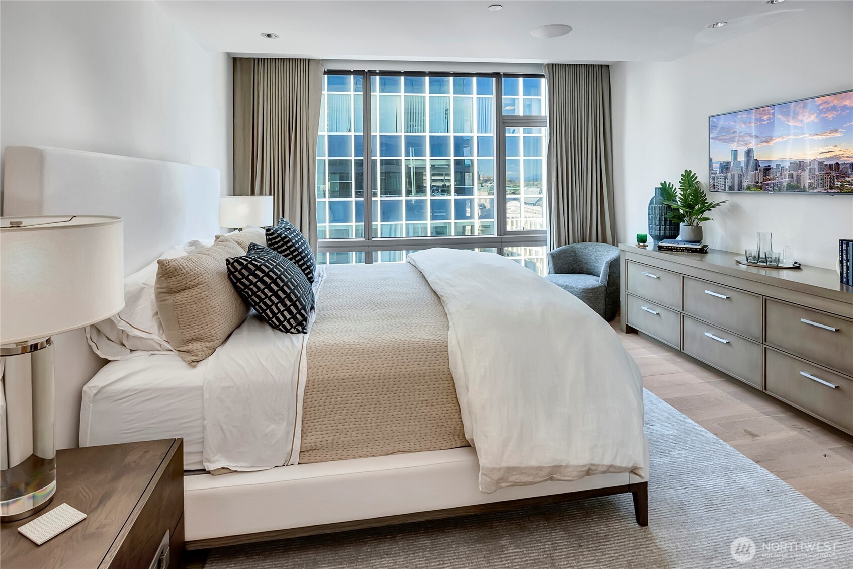 715 2nd Avenue, Unit 1702 Seattle, WA 98104 - Photo 29 of 38 a bedroom with a bed and window