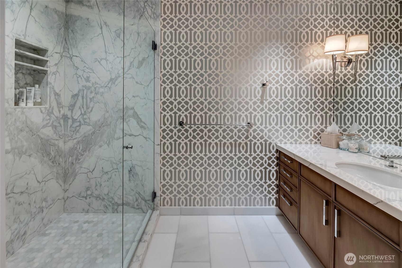 715 2nd Avenue, Unit 1702 Seattle, WA 98104 - Photo 31 of 38 a bathroom with a sink and a shower