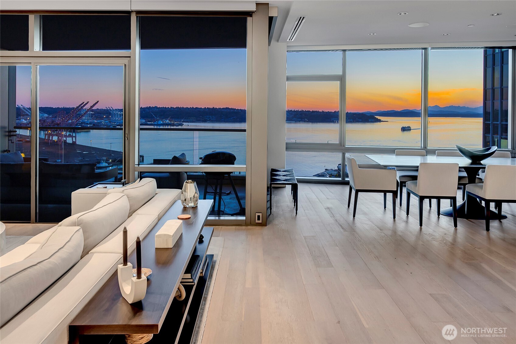 715 2nd Avenue, Unit 1702 Seattle, WA 98104 - Photo 5 of 38 a living room with furniture and large windows