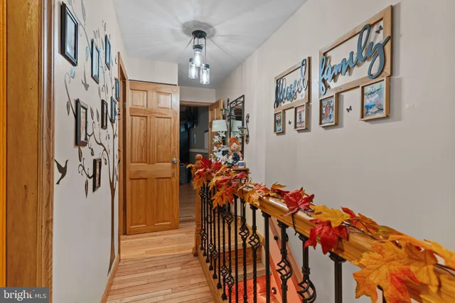 a view of an entryway with wooden floor