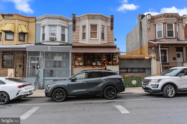a view of a car parked in front of a building