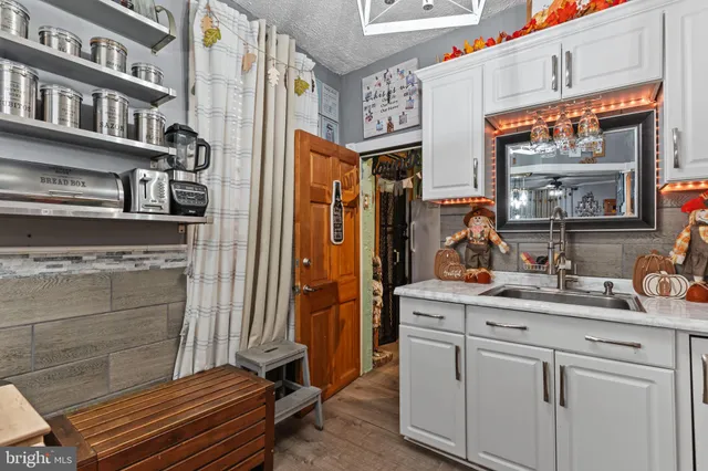 a kitchen with a sink and cabinets