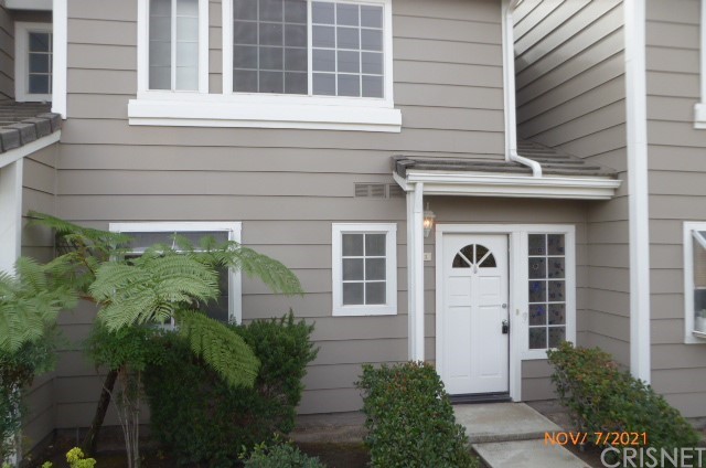 3902 Cochran Street, Unit 3 Simi Valley, CA 93063 - Photo 1 of 1 a front view of a house with plants