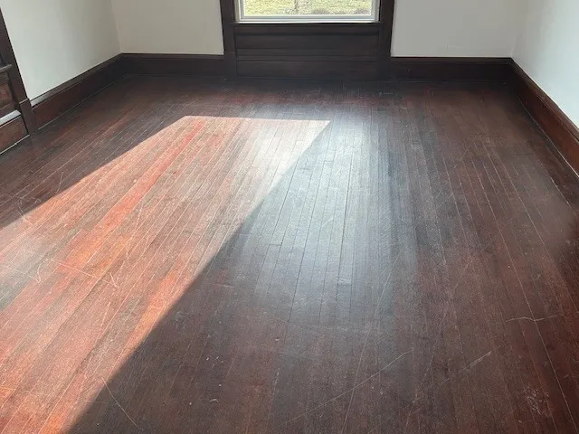 a view of balcony with wooden floor