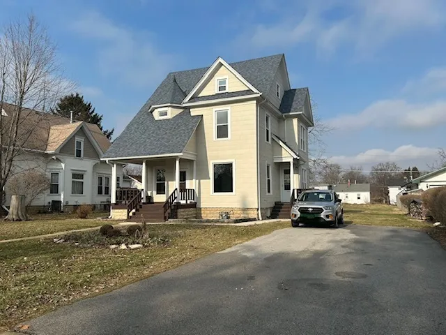 a view of a parked cars in front of a building