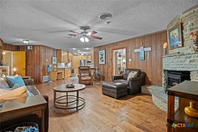 a living room with furniture and a fireplace