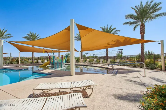 a view of swimming pool with outdoor seating