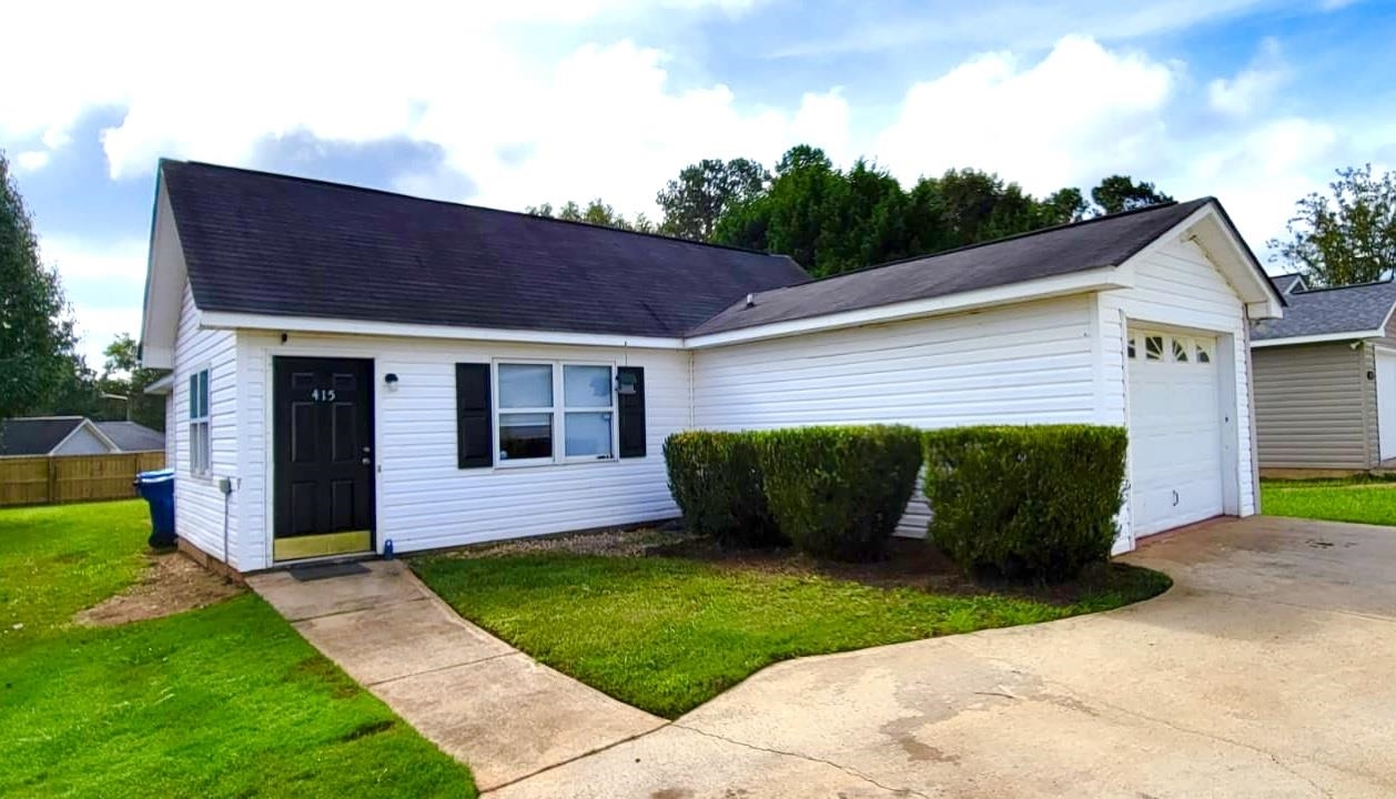415 Hollow Ridge Drive Athens, GA 30607 - Photo 1 of 1 a backyard of a house with yard and outdoor seating