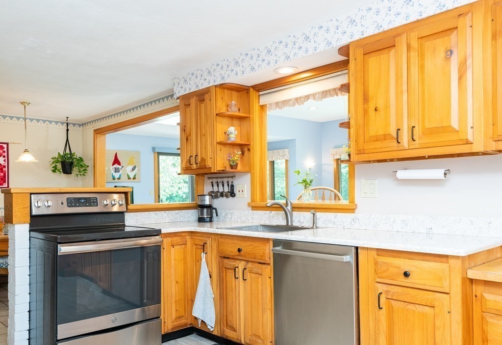 36 Wentworth Road Canton, MA 02021 - Photo 12 of 42 a kitchen with stainless steel appliances granite countertop a sink and cabinets