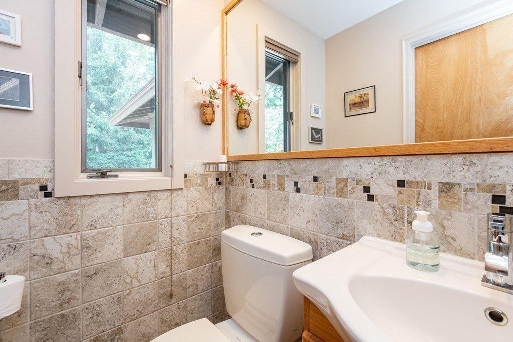 36 Wentworth Road Canton, MA 02021 - Photo 23 of 42 a bathroom with a sink a toilet and a mirror