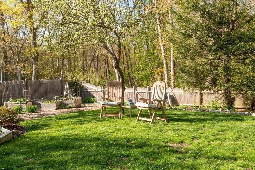 36 Wentworth Road Canton, MA 02021 - Photo 29 of 42 a view of a chair and table in the backyard