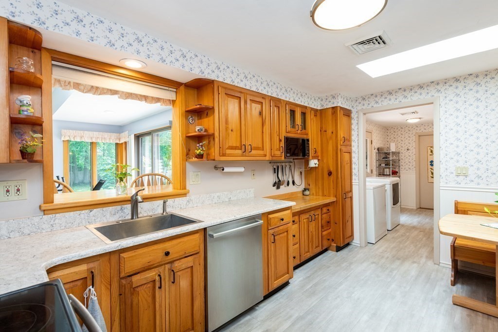 36 Wentworth Road Canton, MA 02021 - Photo 10 of 42 a large kitchen with stainless steel appliances granite countertop a sink and cabinets