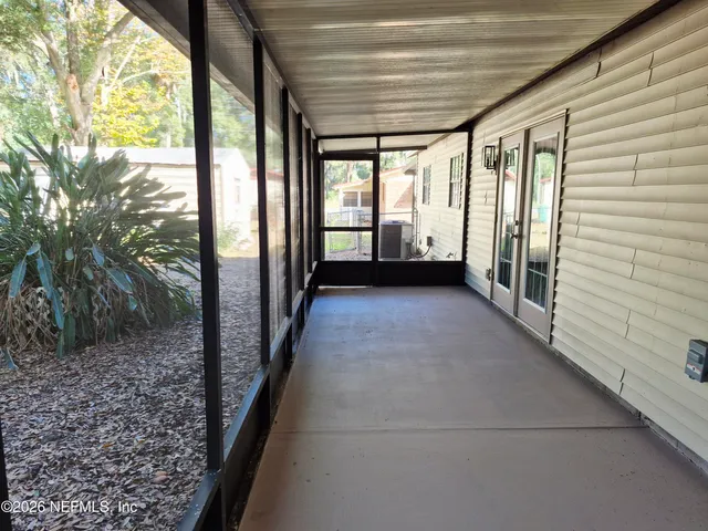 a view of hallway with trees