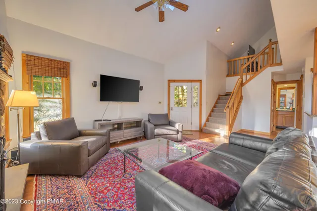 a living room with furniture and a flat screen tv