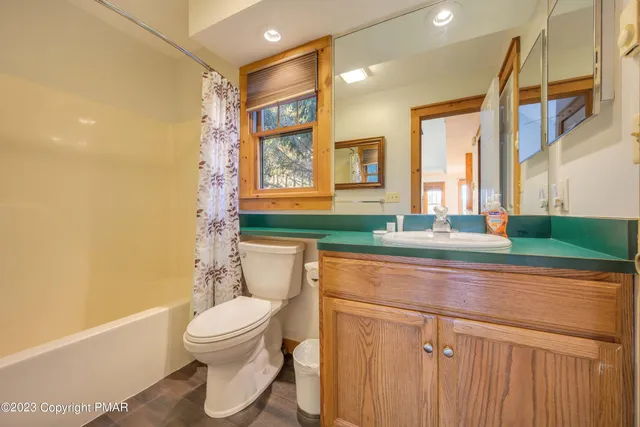 a bathroom with a toilet a sink and a bathtub