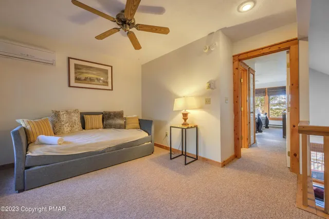 a hotel room with a bed and a chandelier