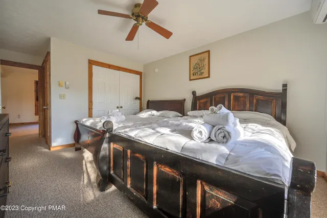 a view of a bedroom with furniture