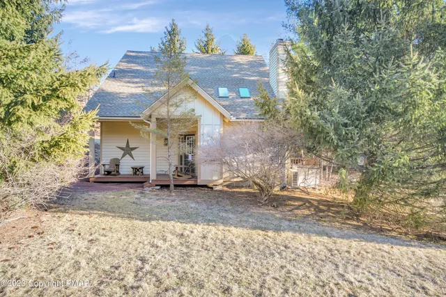 a view of a house with a snow in the yard