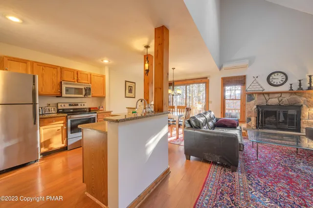 a kitchen with sink refrigerator and stove