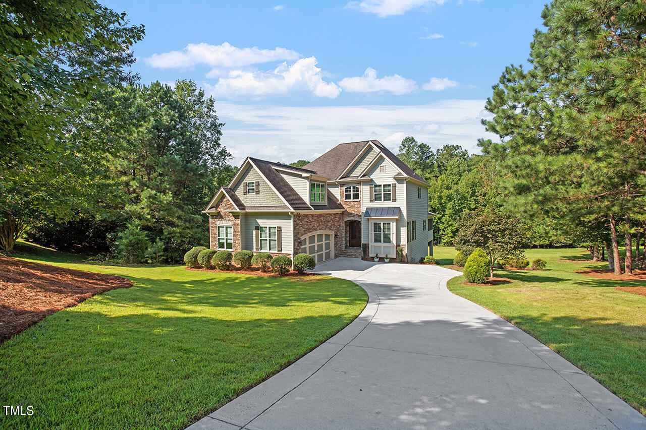 1036 Quiet Ridge Circle Raleigh, NC 27614 - Photo 1 of 60 a front view of a house with a yard