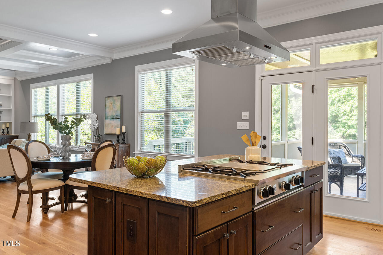 1036 Quiet Ridge Circle Raleigh, NC 27614 - Photo 12 of 60 a kitchen with a stove a sink and wooden cabinets