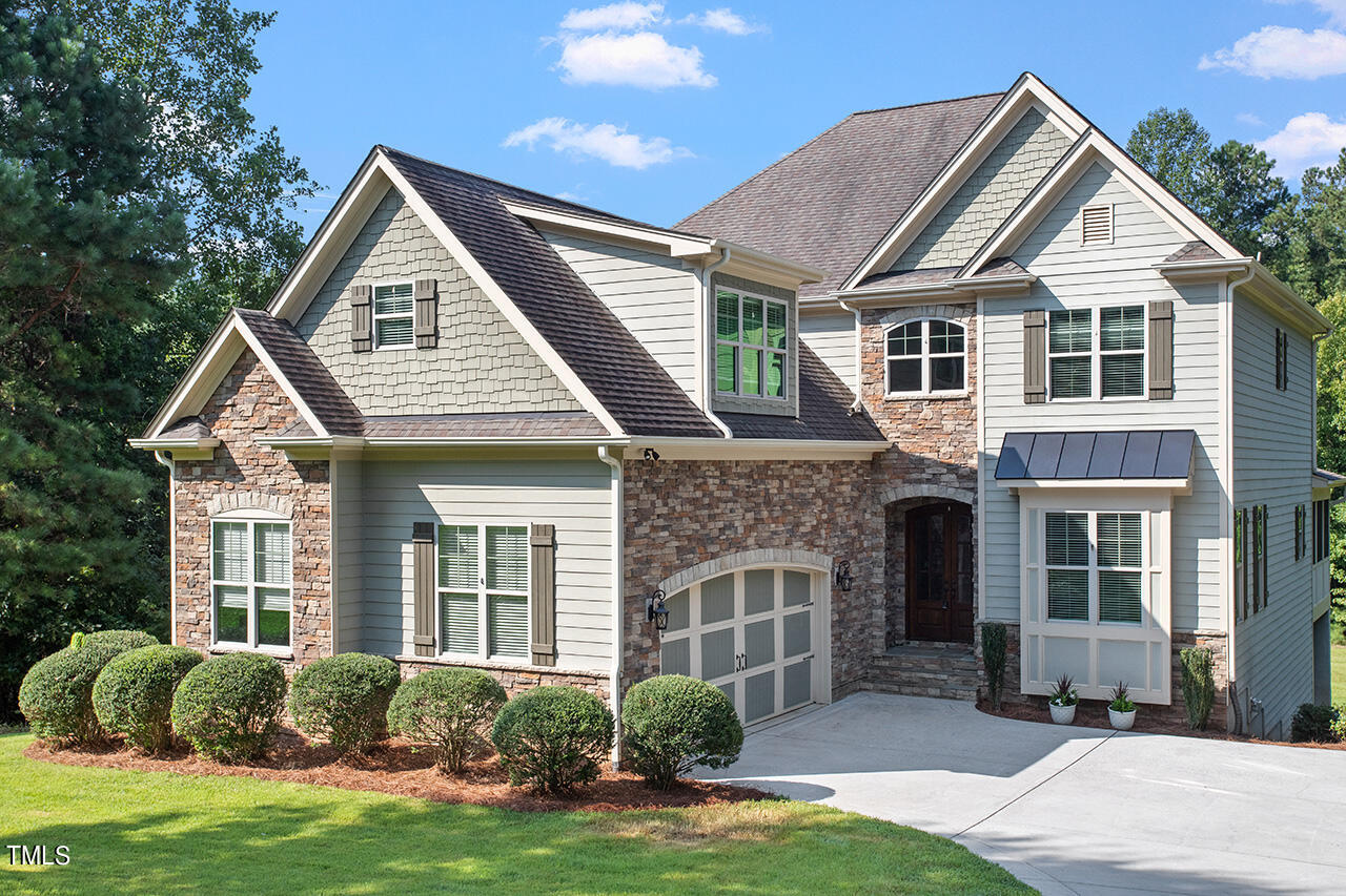 1036 Quiet Ridge Circle Raleigh, NC 27614 - Photo 2 of 60 a front view of a house with a yard