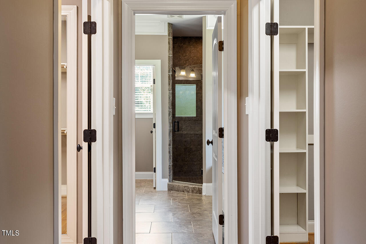 1036 Quiet Ridge Circle Raleigh, NC 27614 - Photo 40 of 60 a view of a bathroom from a corridor