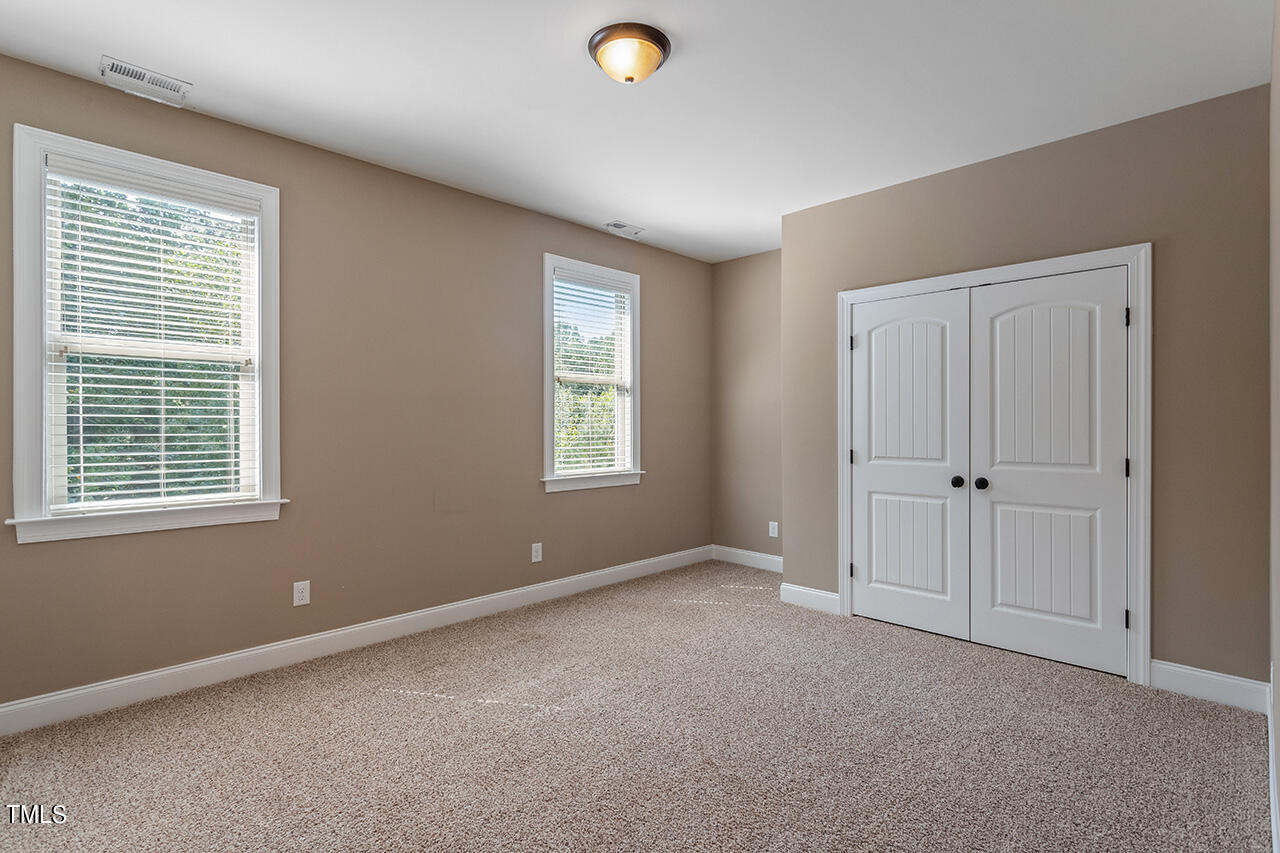 1036 Quiet Ridge Circle Raleigh, NC 27614 - Photo 45 of 60 a view of an empty room with window and closet area
