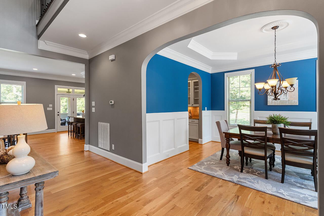1036 Quiet Ridge Circle Raleigh, NC 27614 - Photo 6 of 60 a view of a a dining room with furniture window and wooden floor
