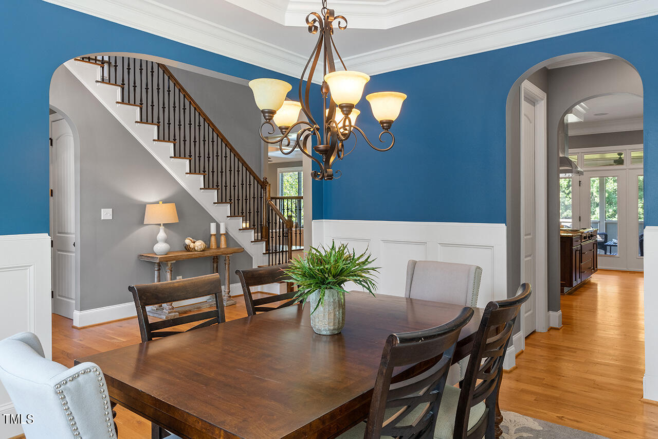 1036 Quiet Ridge Circle Raleigh, NC 27614 - Photo 8 of 60 a view of a dining room with furniture and wooden floor