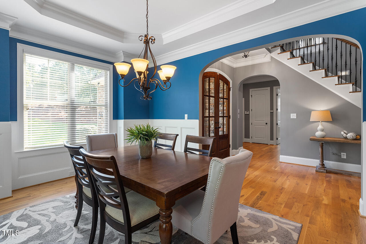 1036 Quiet Ridge Circle Raleigh, NC 27614 - Photo 9 of 60 a view of a dining room with furniture window and wooden floor