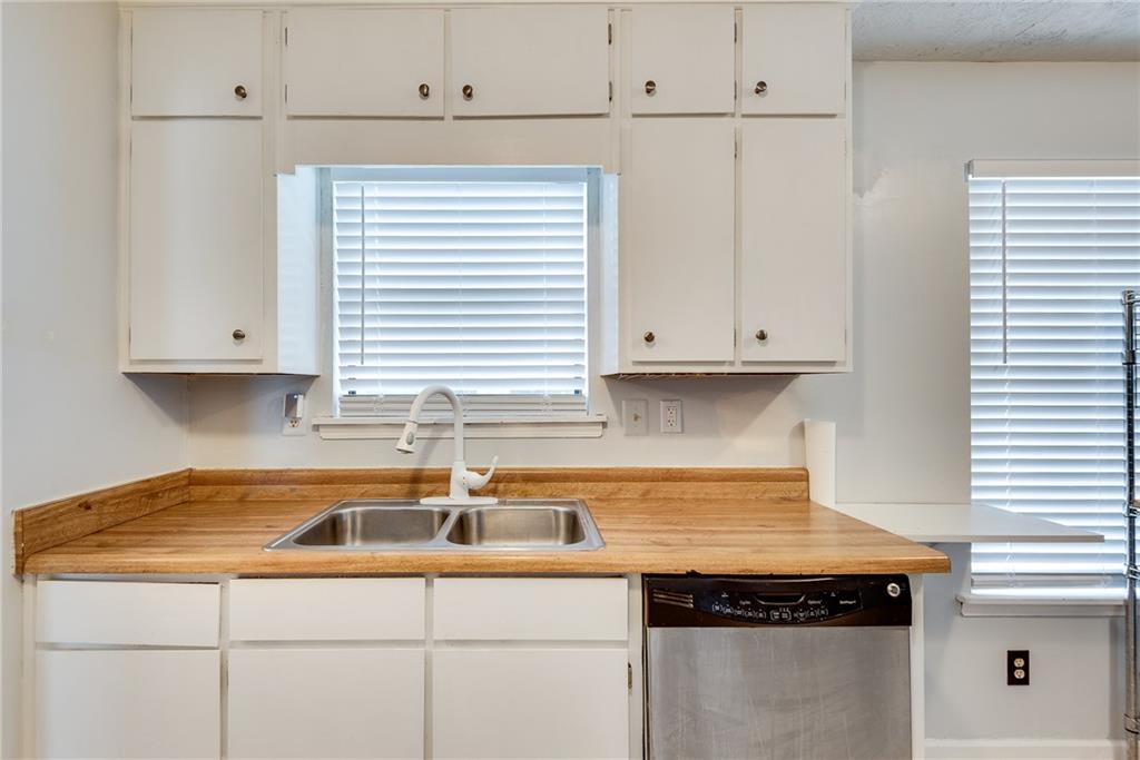 5611 Whittondale Road Lithonia, GA 30058 - Photo 11 of 34 a kitchen with a sink and cabinets