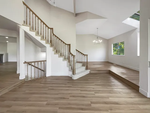 a view of an entryway with wooden floor