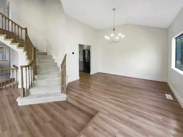 a view of a balcony with wooden floor