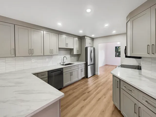 a kitchen with a sink and cabinets