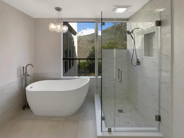 a spacious bathroom with a granite countertop sink a mirror and a