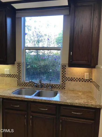 a sink sitting next to a window