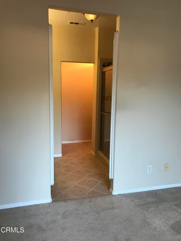 a bathroom with a shower and a sink