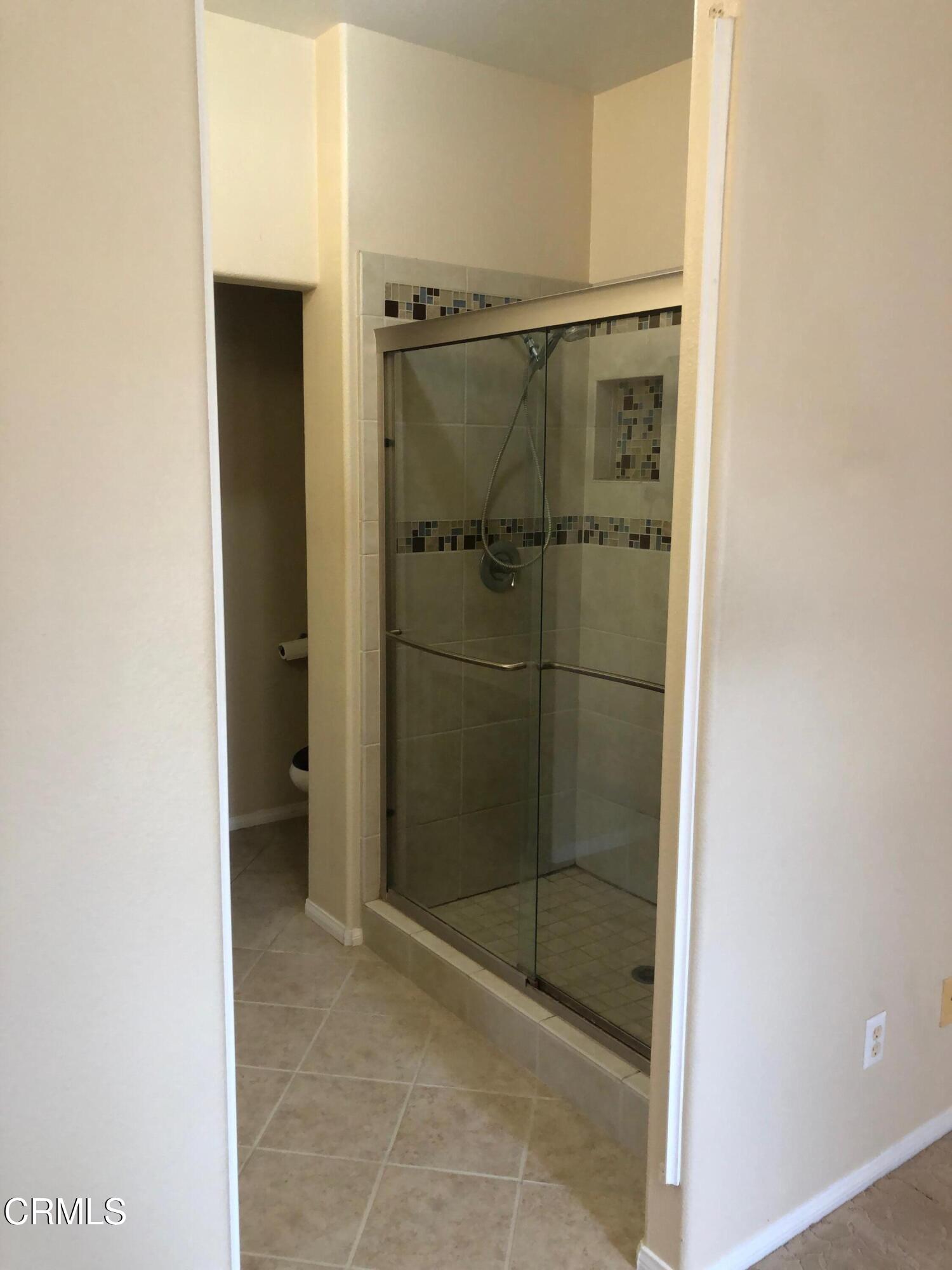 3732 Shelley Place Oxnard, CA 93033 - Photo 20 of 26 a bathroom with a shower and a sink