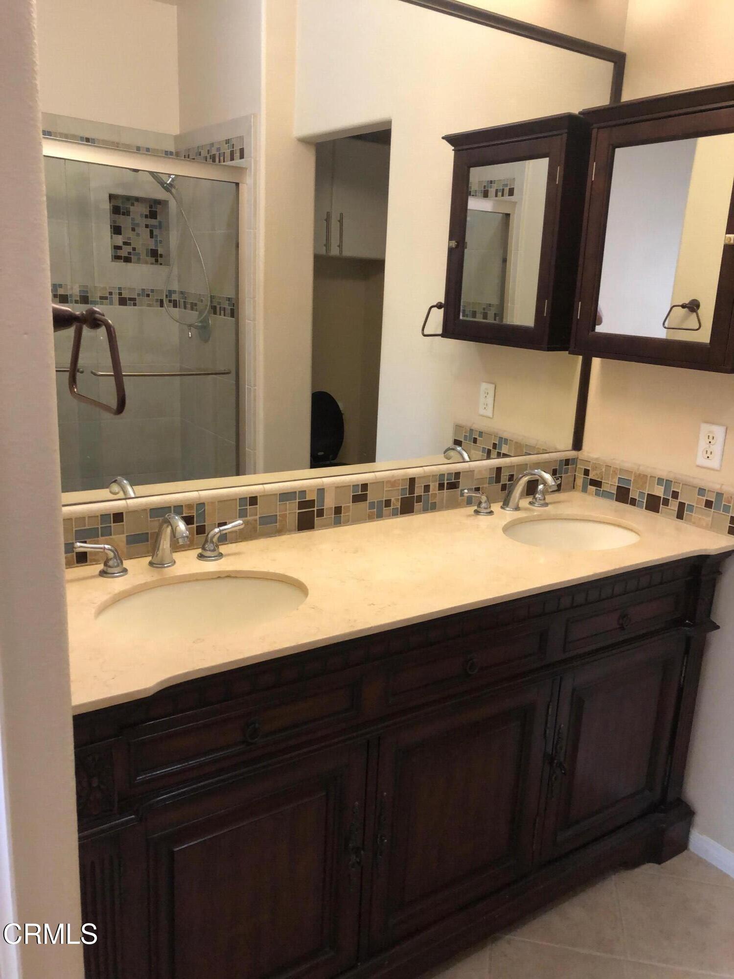 3732 Shelley Place Oxnard, CA 93033 - Photo 22 of 26 a bathroom with a sink and a mirror