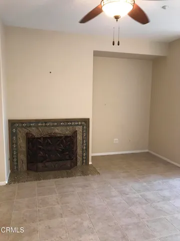 an empty room with a fireplace