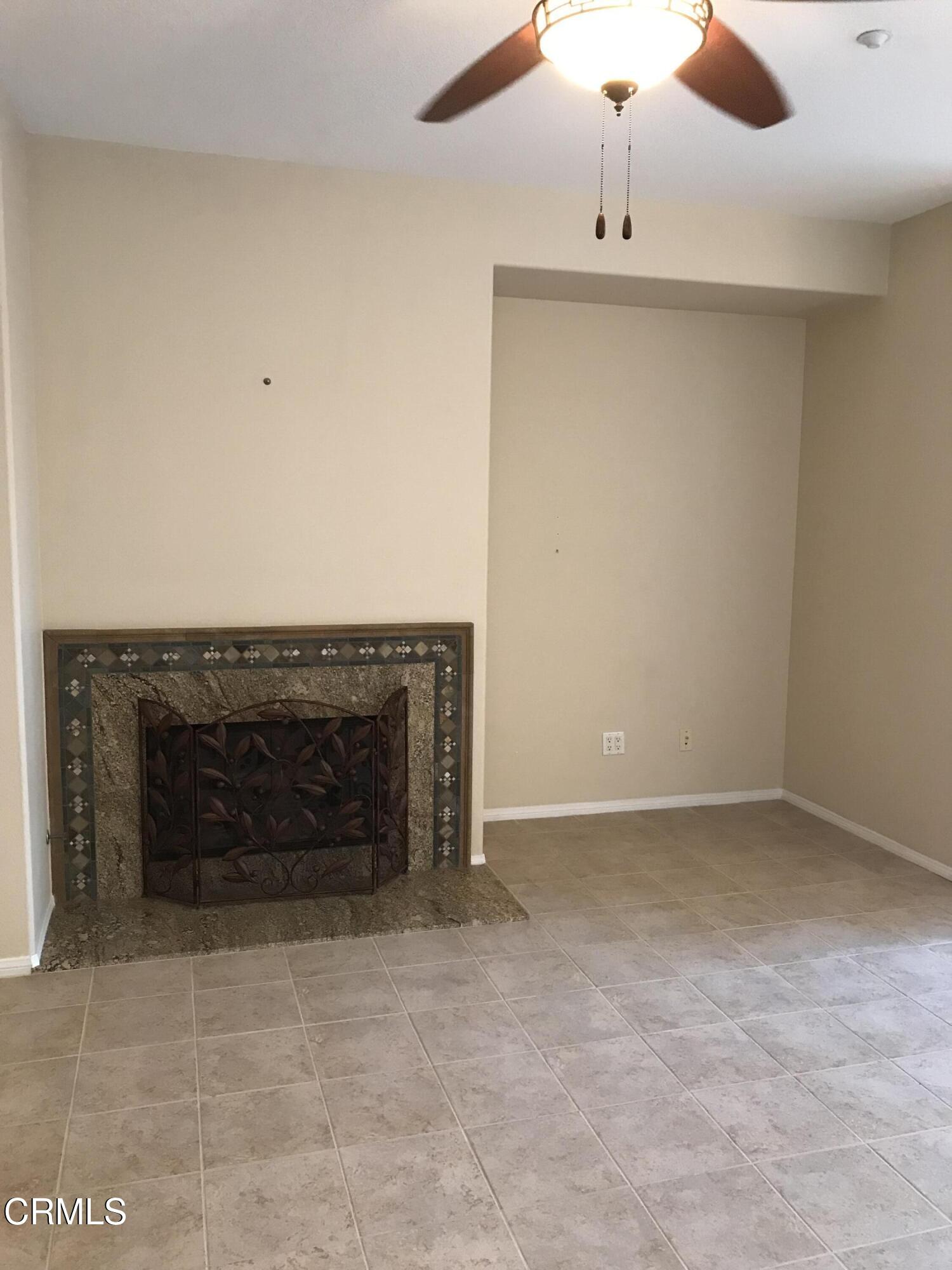 3732 Shelley Place Oxnard, CA 93033 - Photo 6 of 26 an empty room with a fireplace