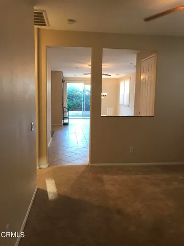 a view of hallway with wooden floor