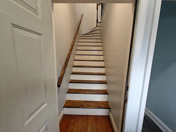 a view of entryway with wooden floor