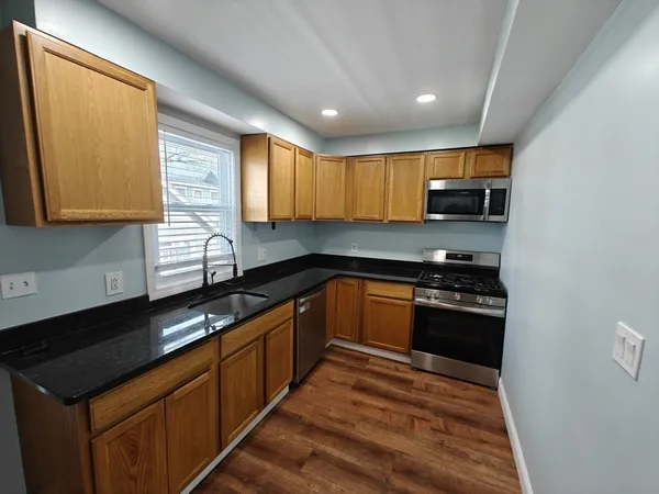 a view of a kitchen with washer and dryer